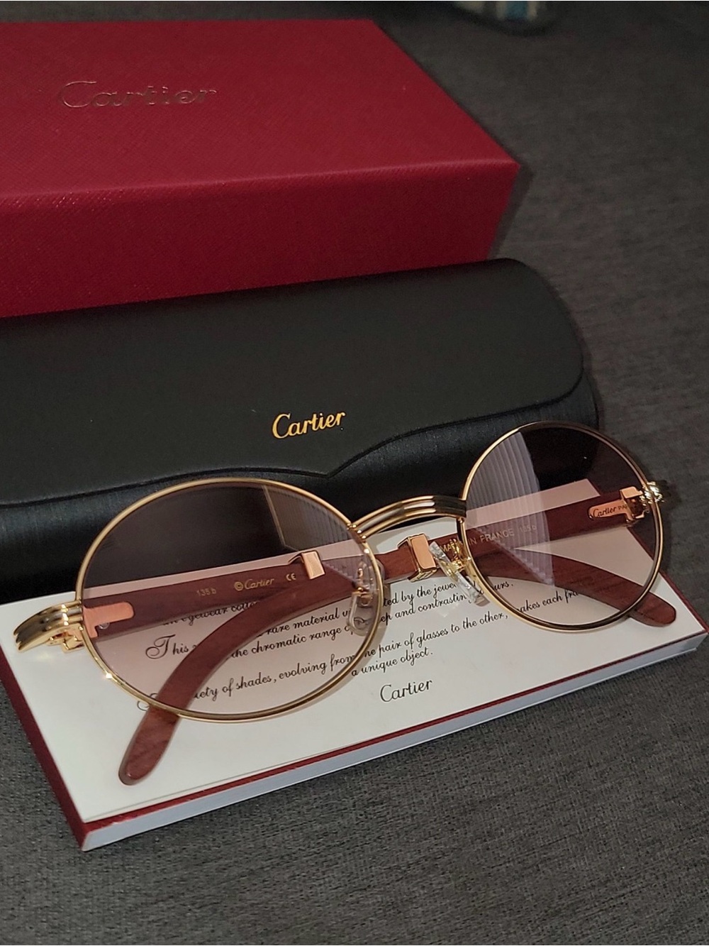 Cartier Men's Round Metal Sunglasses in Rose Gold with Pink Gradient Lenses.